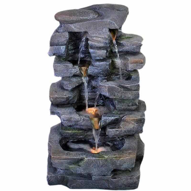 Wielopoziomowa formacja skalna Oświetlona fontanna wodna
