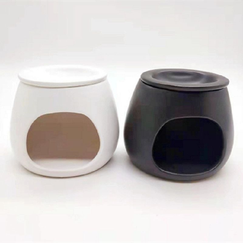 Ręcznie robiony biały i czarny ceramiczny palnik do wosku