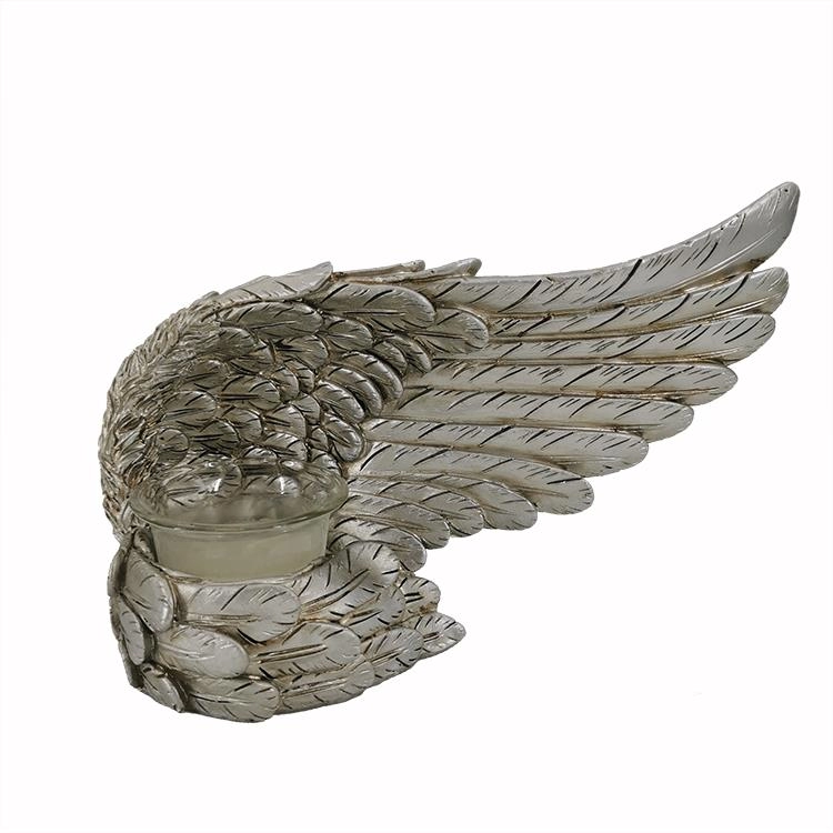 Żywiczny srebrny świecznik z figurką skrzydła anioła